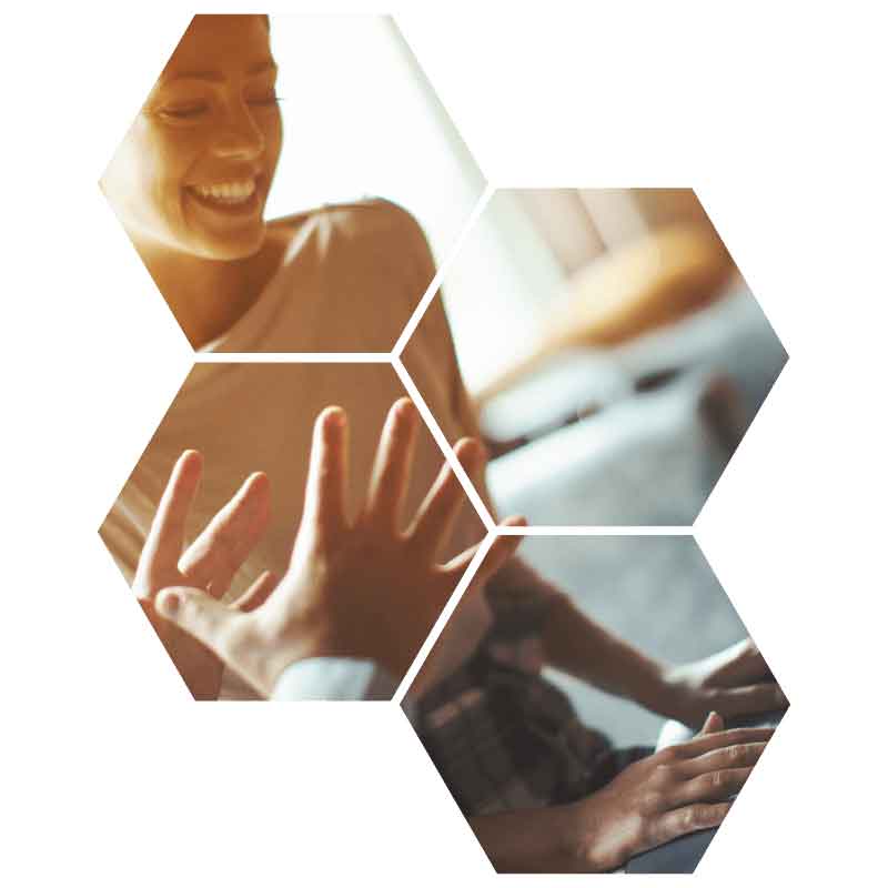 Octagon image with women talking to someone while on the computer smiling.