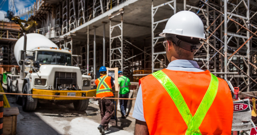 a worker overlooking a construction job.