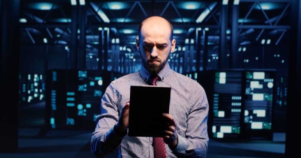 A business owner looking at his iPad.
